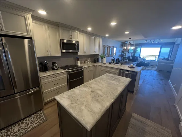 walk into the open kitchen with views of the Beach