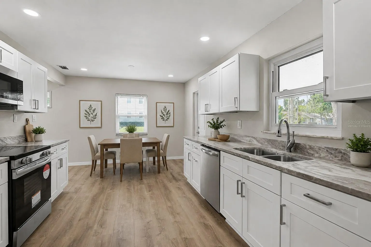 Eat In Kitchen and Door Leading to Carport Virtually Staged