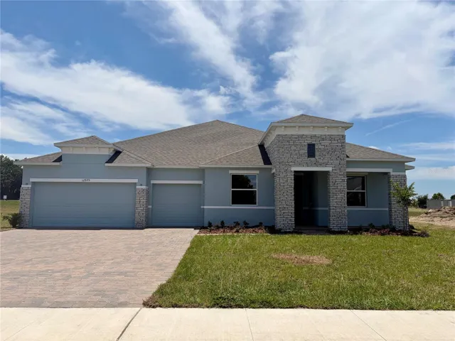 Stunning Exterior - Block construction, 3-car garage, stone accent, brick pavers!