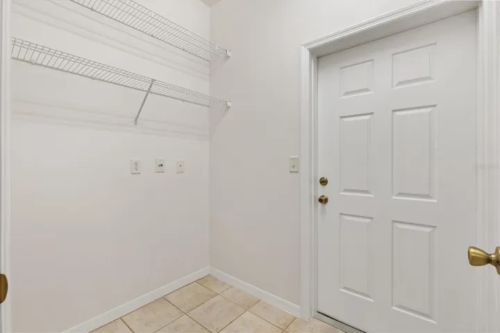 Large room off kitchen that could be converted back to a laundry room.