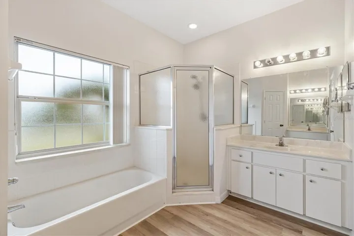 Dual vanities, large tub, walk-in shower, private water closet.