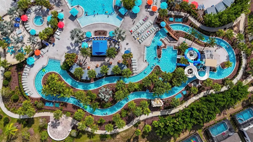 Enjoy the RESORT-STYLE POOL, lazy river, tube slides, poolside bar and restaurant, mini golf, fitness center, and multiple sports courts.