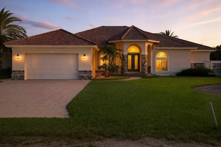 Front View – This custom home showcases exceptional design and countless features that set it apart