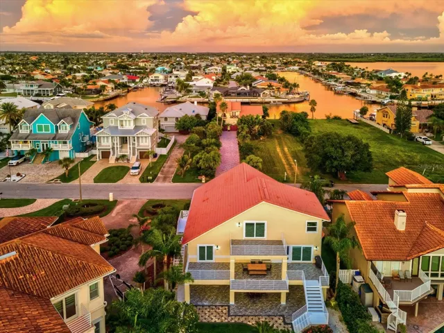 Luxury coastal estate, open concept, chef’s kitchen, Sub-Zero appliances, spa-inspired bathrooms, Jacuzzi tub, granite vanities, custom tile, plantation shutters, move-in ready