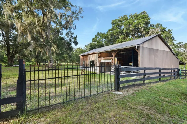 Garage #2 with car lift and 1 car bay on one side with 2 car garage and half bathroom on the other side (35ft x 48ft) (35ft x 48ft)