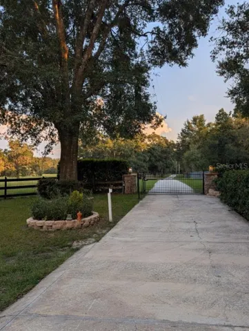 Driveway approach leading to main residence and accessory structures