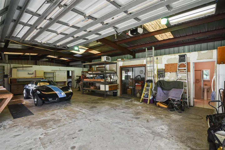 Garage #1 with Office (center of picture), full bathroom to the right and space to the left for multiple cars. (28.5ft x 56.5ft)