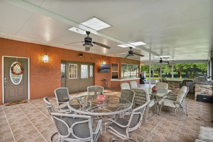 Huge 46.5 x 24ft outdoor living room with grill/bar seating
