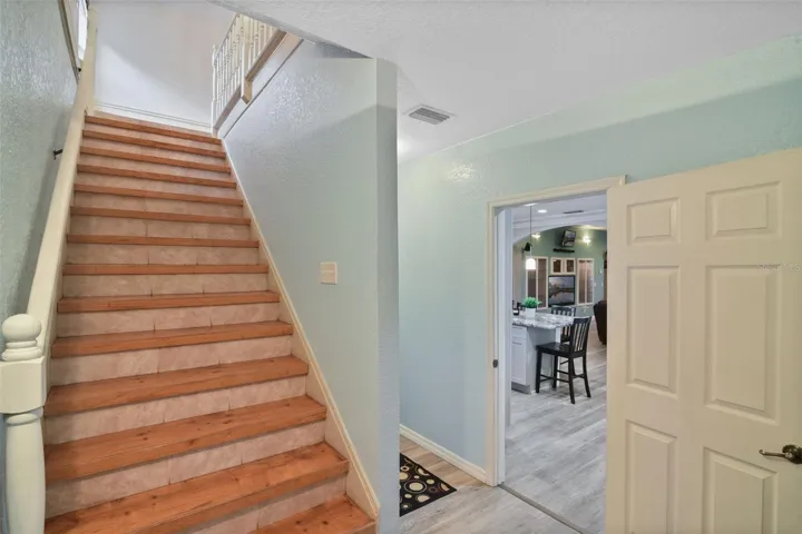 stairs behind the kitchen