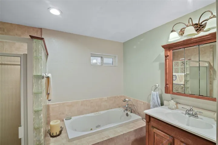 Alternate view of primary bathroom highlighting layout