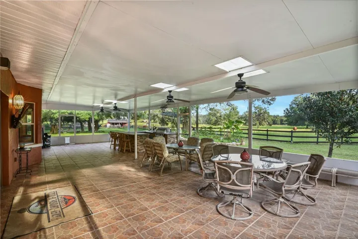 Huge 46.5 x 24ft outdoor living room with grill/bar seating