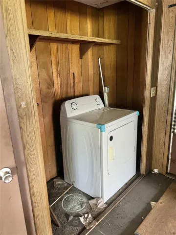 There's a washer & dryer closet to the left of the kitchen.