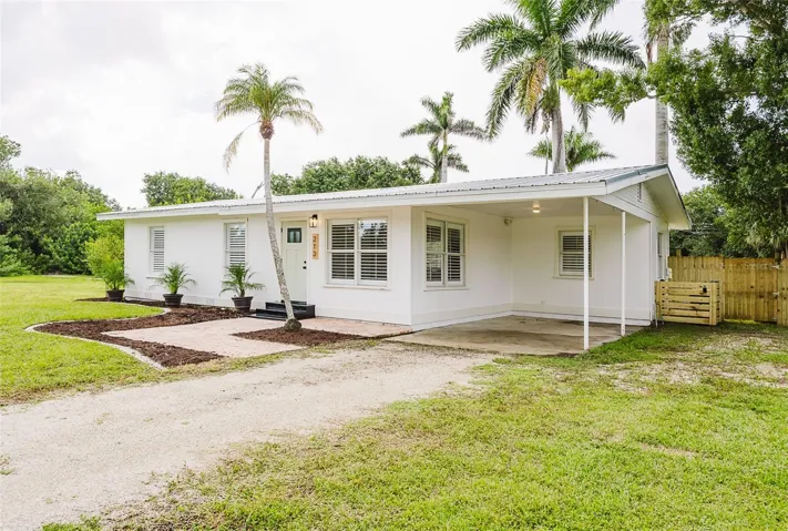 Front of house with carport