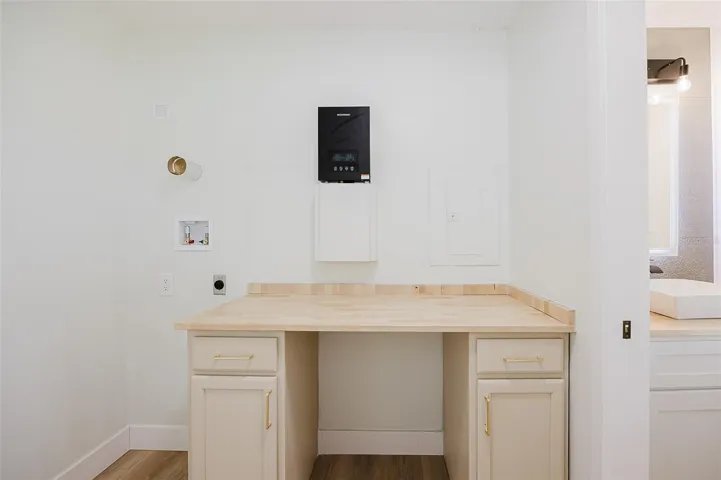 Laundry Room with Tankless Water Heater