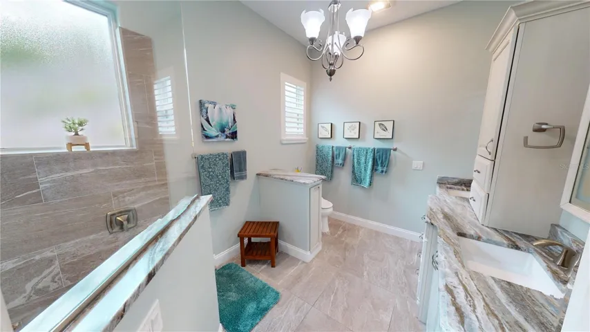 Primary Bath-Dual sinks, granite countertops and accents, walk in shower