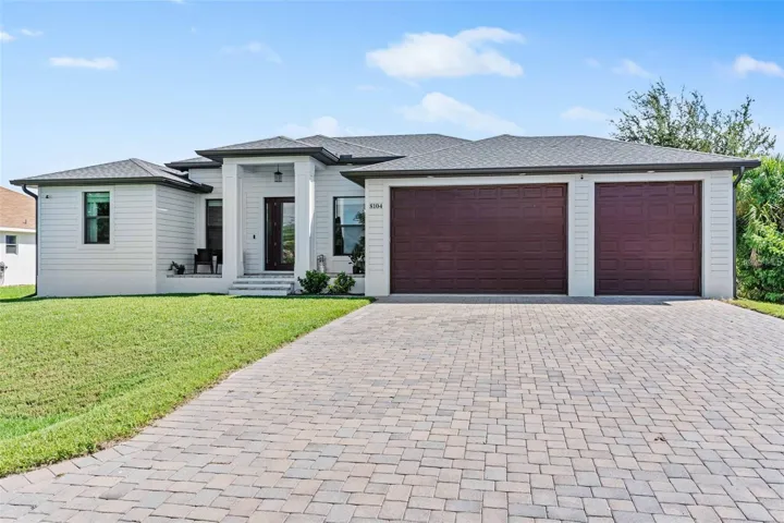 Luxury, space, and privacy await in this 2020-built South Gulf Cove home with a heated saltwater pool and oversized, buildable lot.