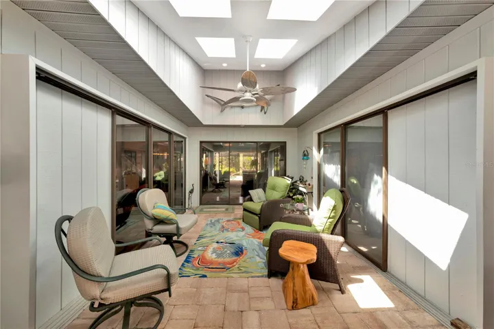 Covered lanai opens to pool