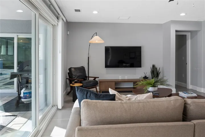 LIVING ROOM & SLIDERS TO PATIO/POOL