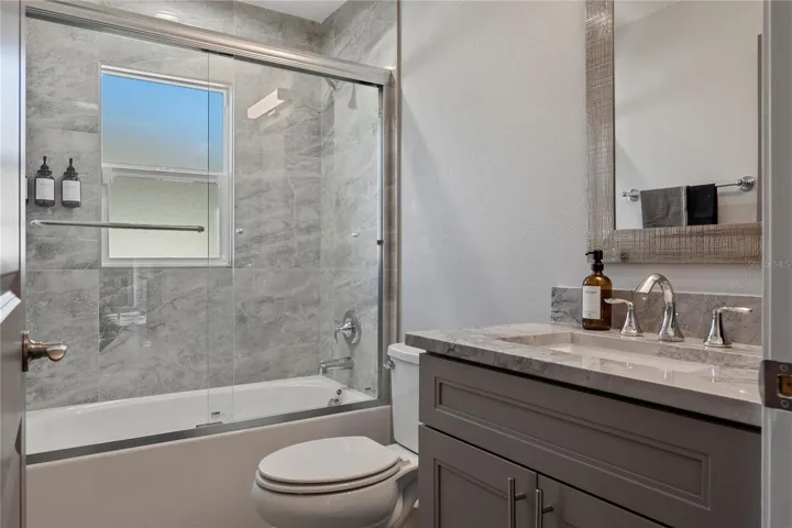 MAIN BATH HAS TUB, SHOWER AND MARBLE