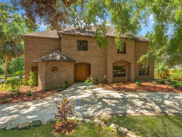 Nestled at the end of a quiet cul-de-sac on over an acre of lush, tropical landscape, this custom-built, all-brick riverfront estate offers an extraordinary lifestyle—blending modern comfort and resort-style amenities. 4 bedrooms, 3 full and 2 half baths, indoor pool/Spa, Elevator, 2 fire places, & wet bar