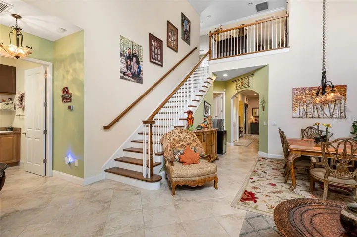View from the front door. Greeted by high ceilings and beautiful tile flooring.