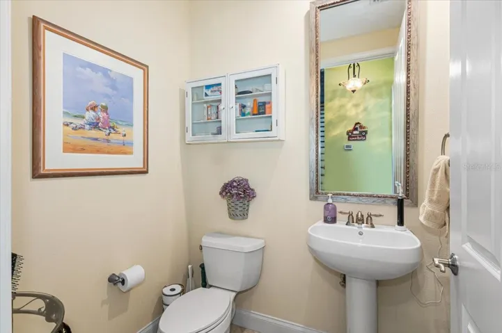 Guest half bath located downstairs