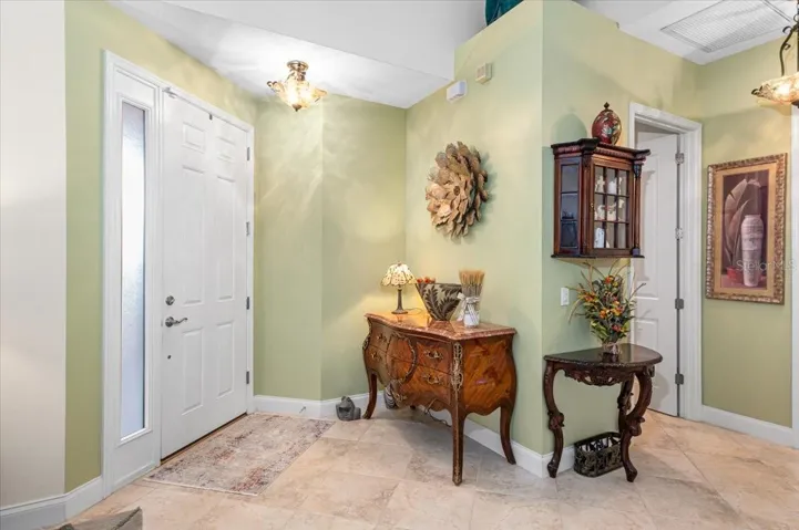 Front door, guest half bath located on the right.