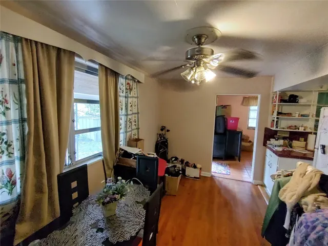 Hallway to kitchen and door for the apartment
