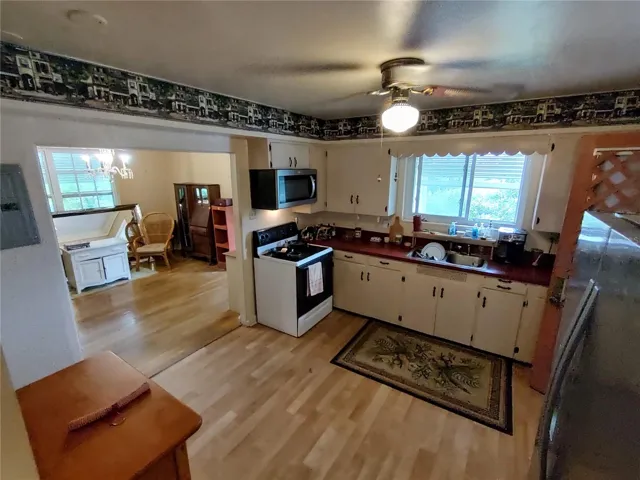 Kitchen with dining room to the left.