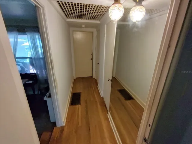 Hallway from the master bedroom. Living room to the left, bedroom #2 straight ahead