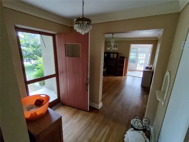 Front doorway to home with dining room in back ground