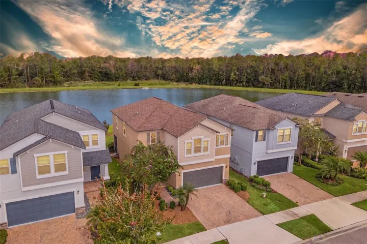 Curb appeal meets privacy on a premium pond lot in Bexley.