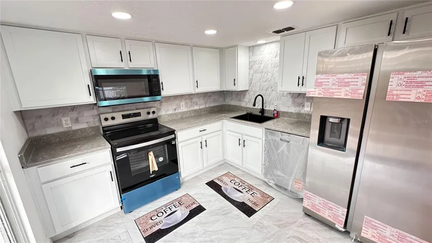 Kitchen with stainless steel appliances