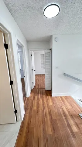 Hallway connecting bedrooms and bathrooms