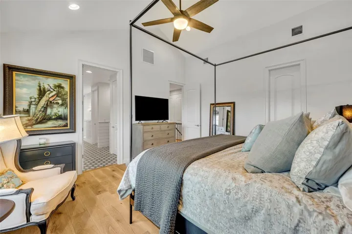 Privacy shades, walkin closet and soaring ceilings give the Primary a sophisticated, modern feel