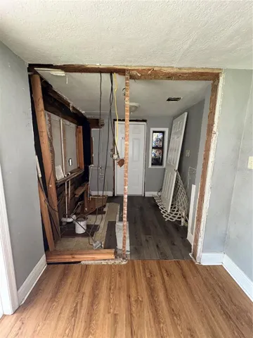 Second bathroom with door to side porch in kitchen