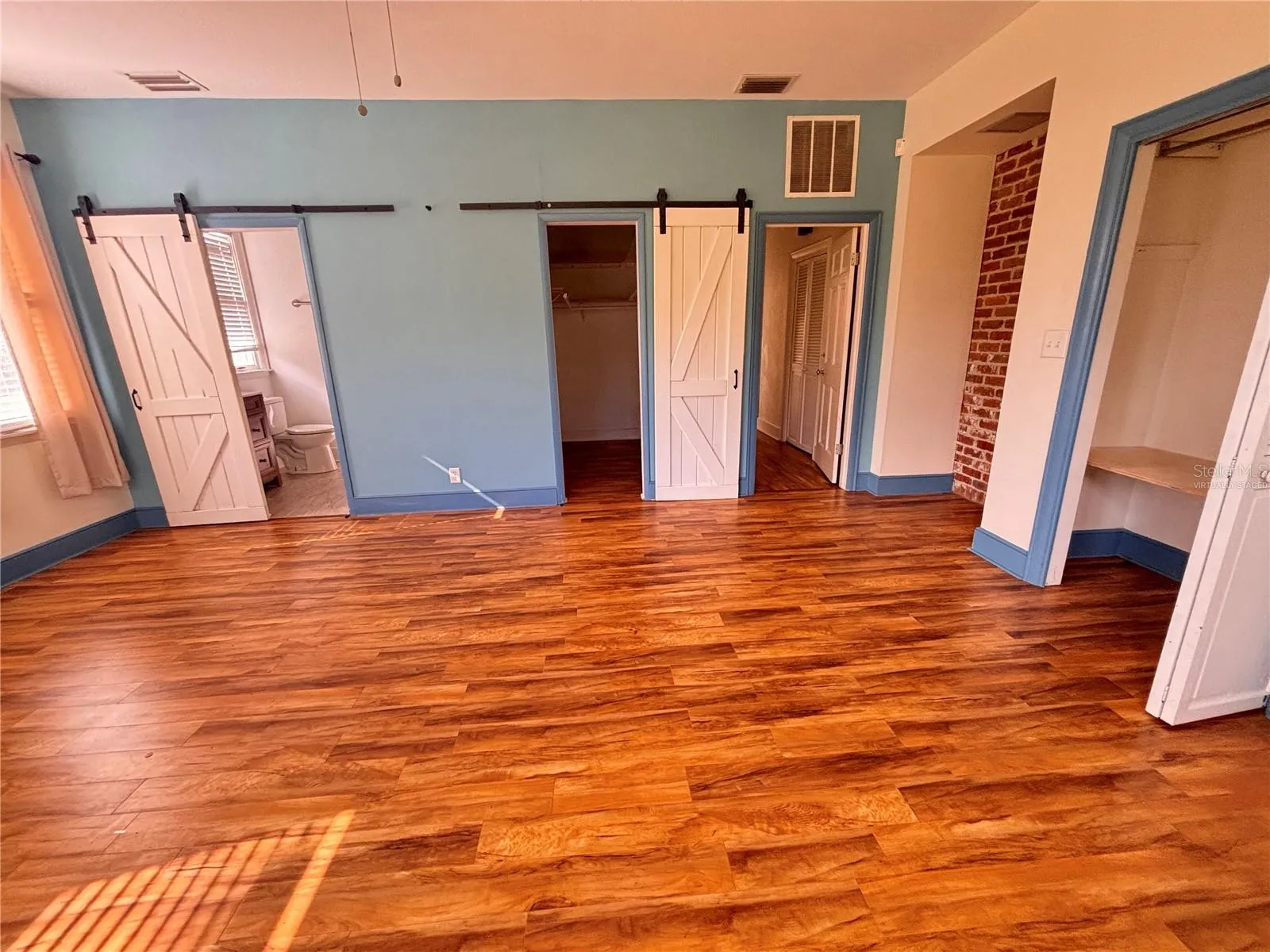 Primary bedroom ready for personalization - see before and after virtually staged photo