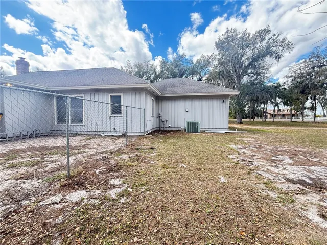 Huge covered porch - fenced dog run, room for a huge pool or expansion of home and so much more!