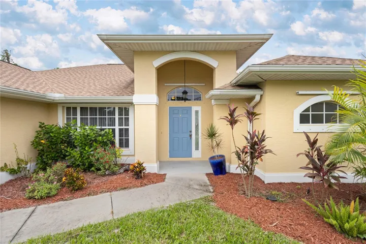 Front view with lush landscaping
