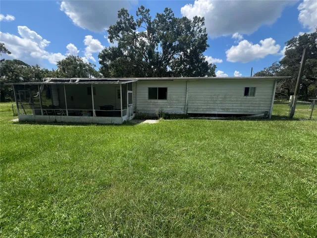 There's a useable concrete slab within the screened porch.