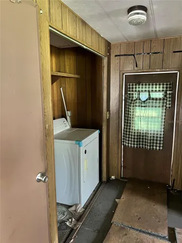 There's a washer and dryer closet adjacent to the kitchen.