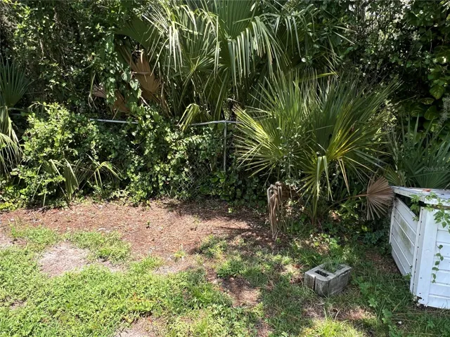 There is a chain link fence along the back of the property.