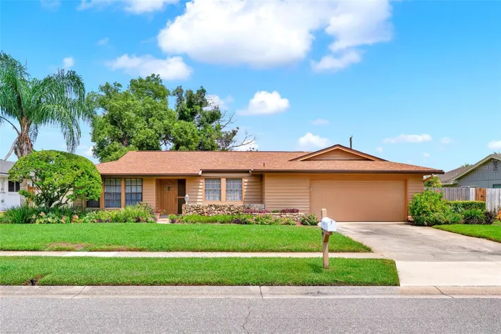 Beautiful lush landscaping and BRAND NEW ROOF!
