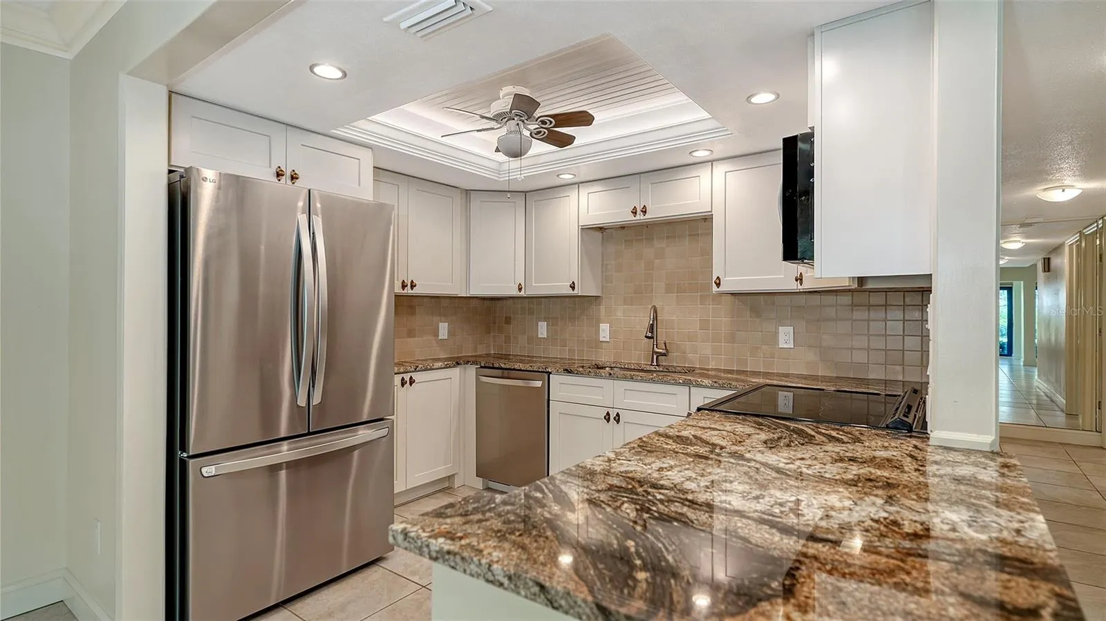 New 2025 kitchen with granite counters, stainless LG appliances, new soft close cabinetry &amp; recessed lighting.
