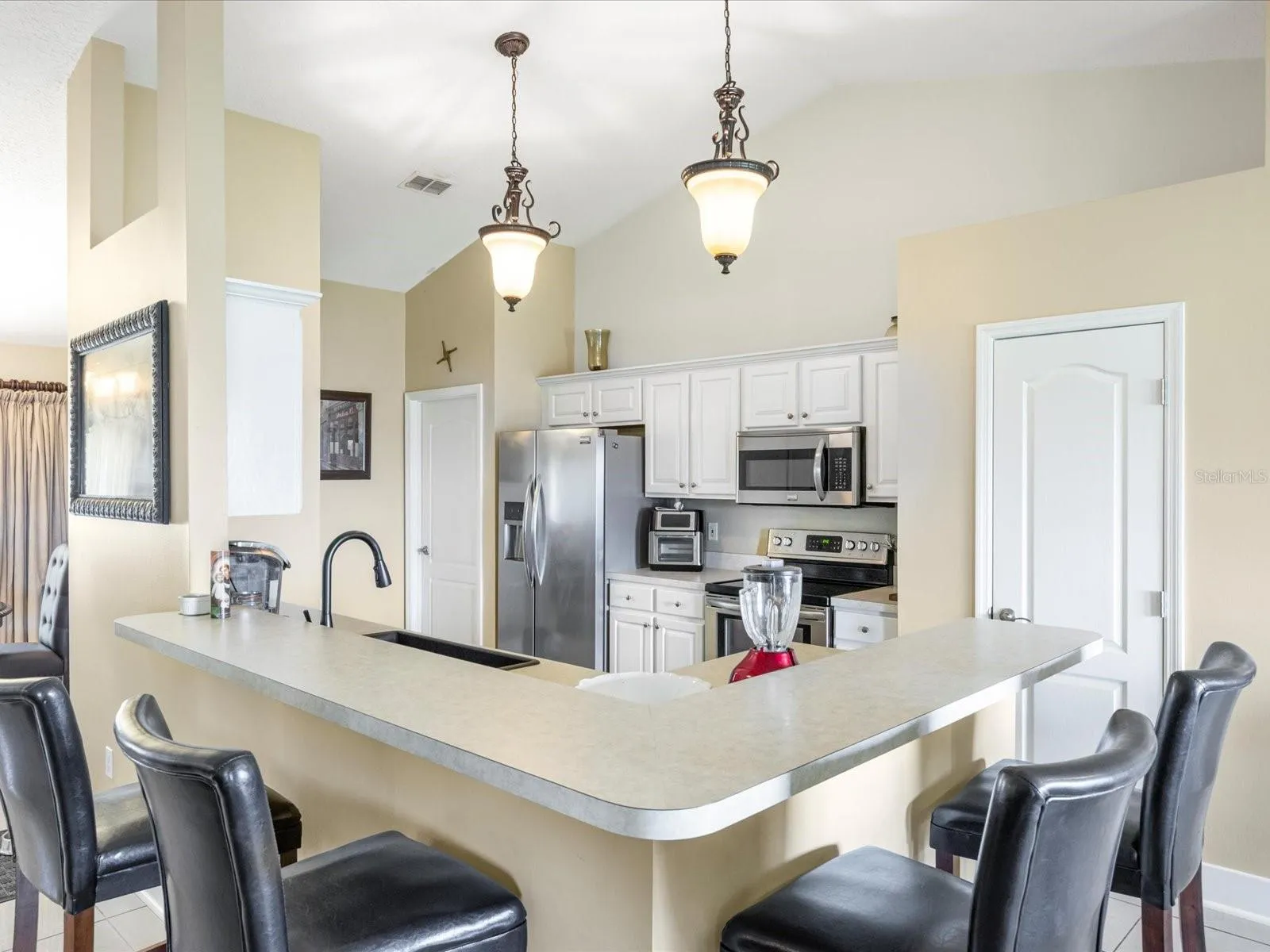 Breakfast Bar with Updated Pendant Lighting