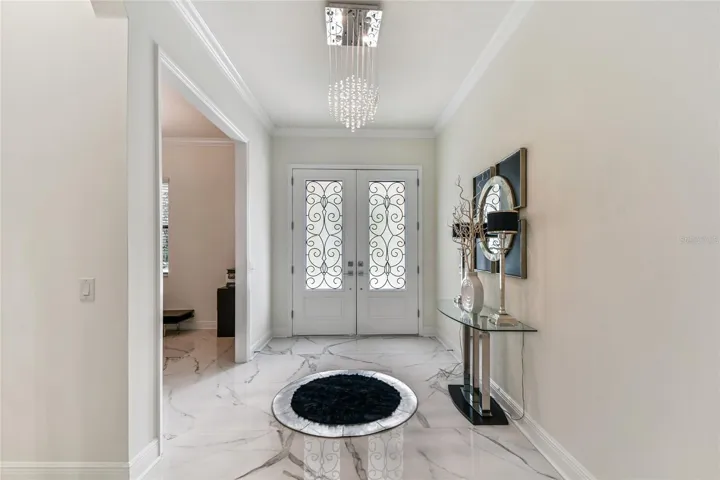 Foyer open to home office to left