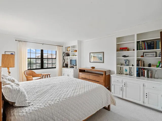 with Lake ViewsPrimary Bedroom with Custom Built-Ins and Lake Views
