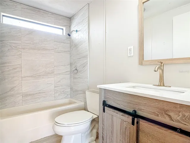 Second bathroom has Tiled shower, bathtub
