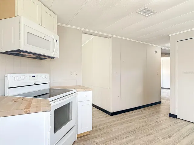 kitchen opens to the dining room and living room