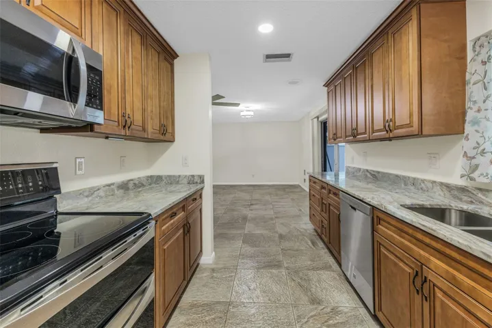 Updated kitchen, solid wood soft close cabinetry, stainless steel appliances